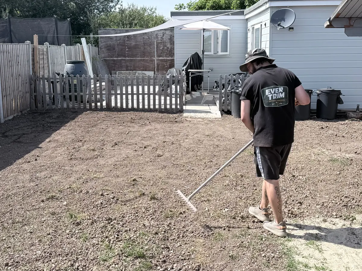 Evertrim raking and preparing the cleared garden ground